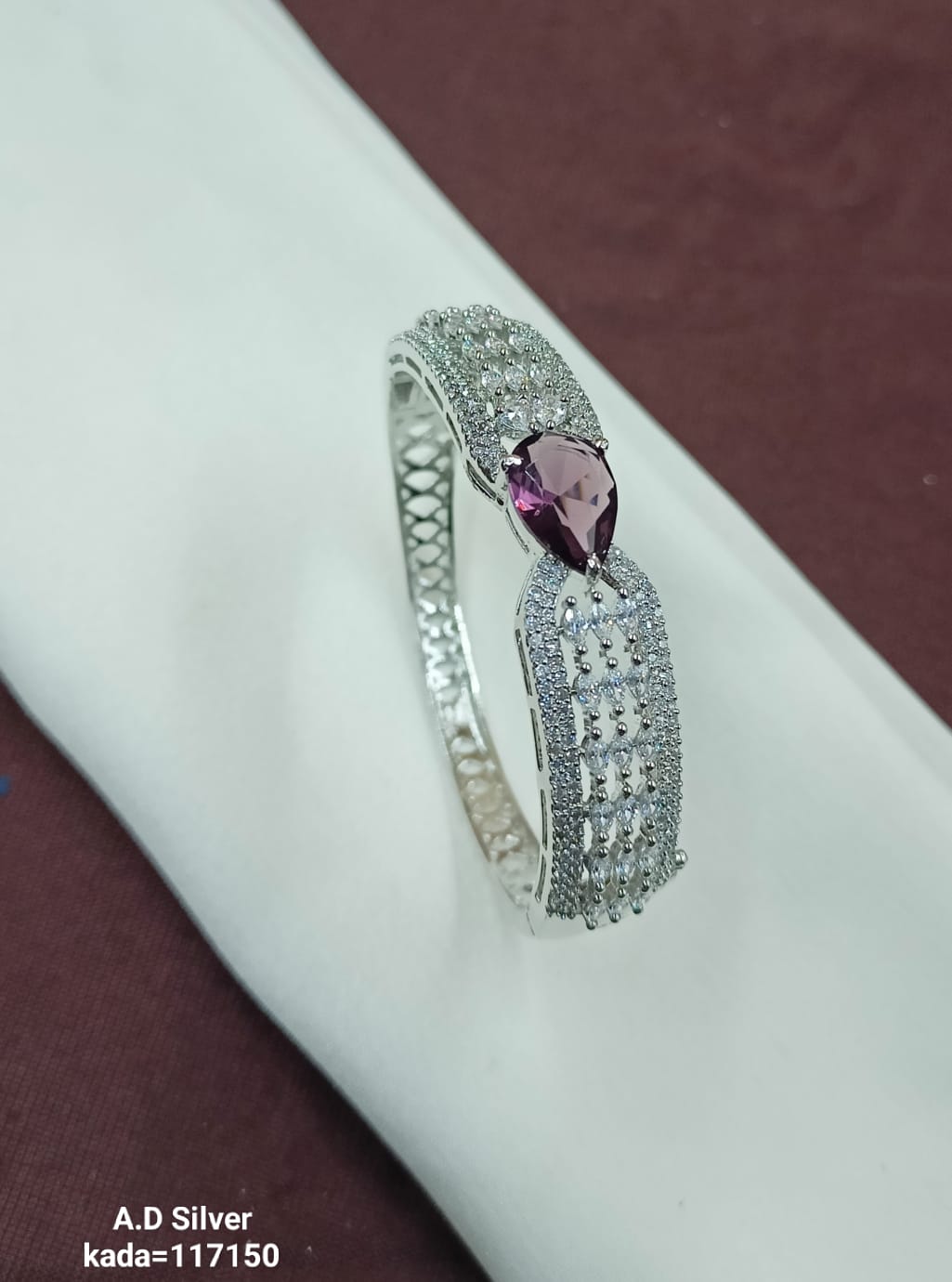 Sparkling A.D. Silver Bracelet with Violet Teardrop Center – Design